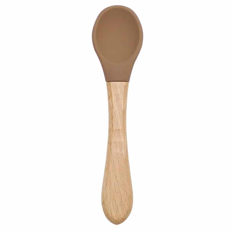 Couvert Ergonomique Bébé avec Manche en Bois, sur un fond blanc.